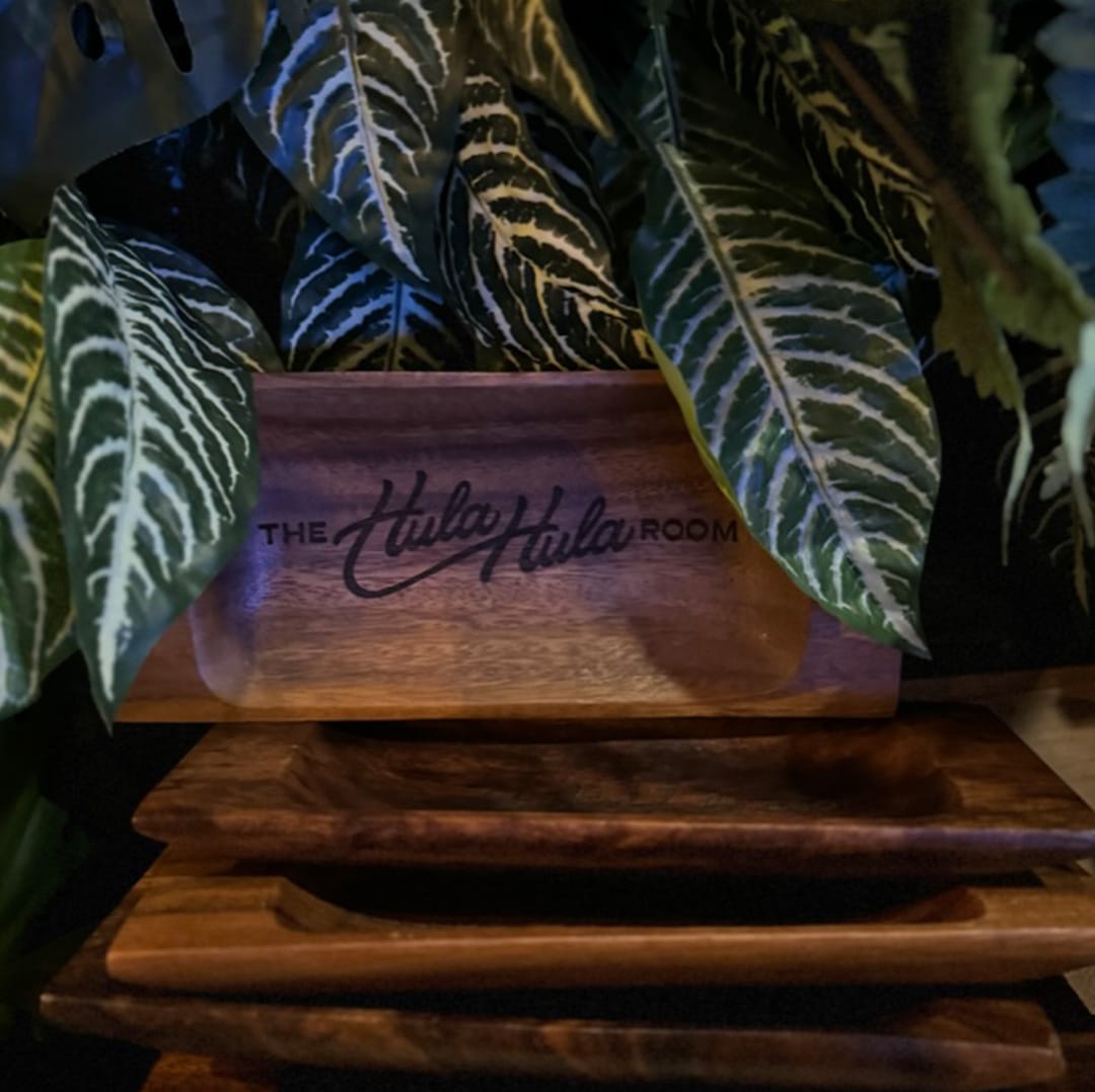 Custom check presenter for The Hula Hula Room Tiki Bar in Torrance California designed by Stellen Design logo design and branding agency in Los Angeles California specializing in logo design for hospitality brands