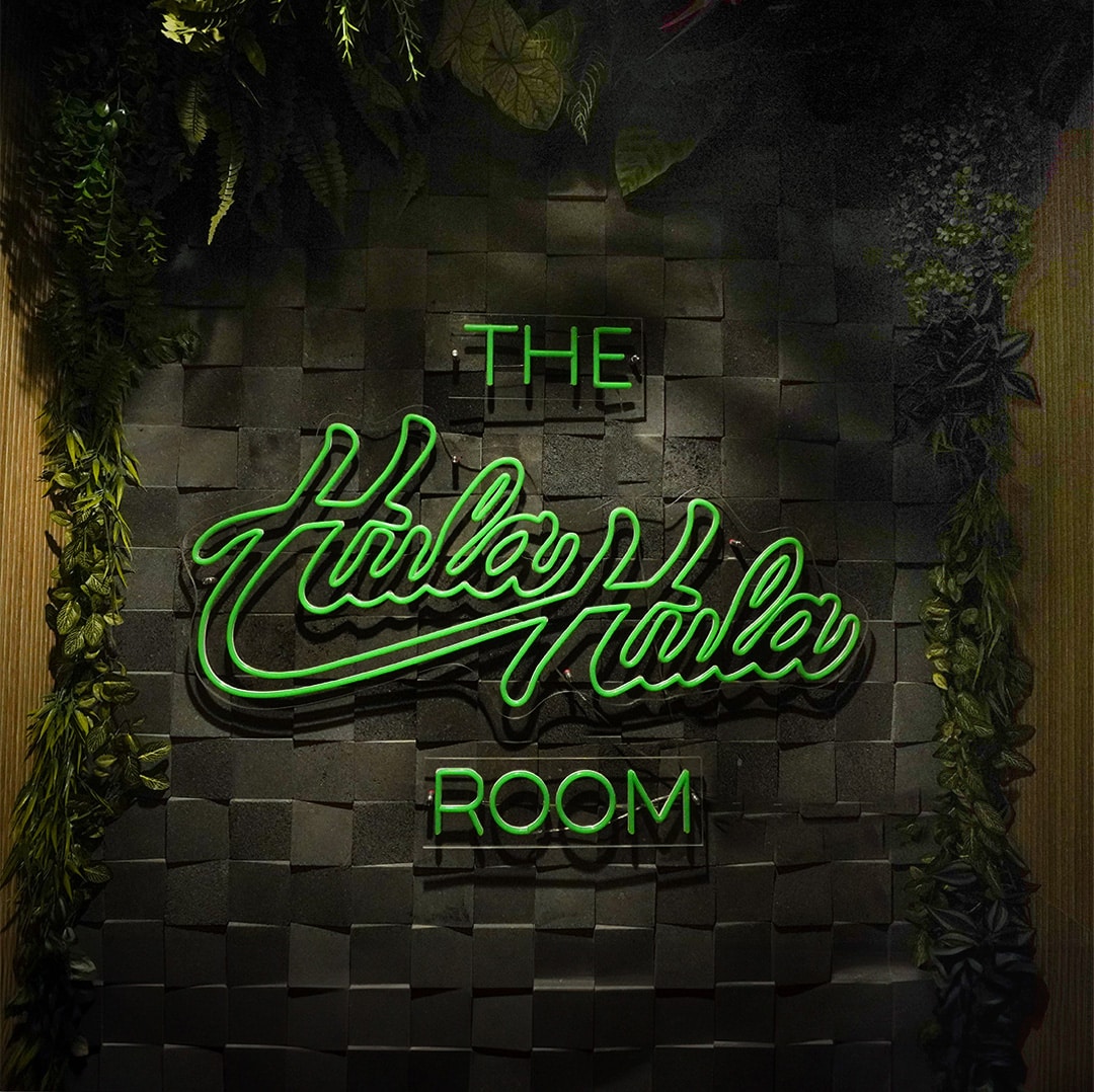 Logo Design in a neon for The Hula Hula Room Tiki Bar in Torrance California designed by Stellen Design logo design and branding agency in Los Angeles California specializing in logo design for hospitality brands