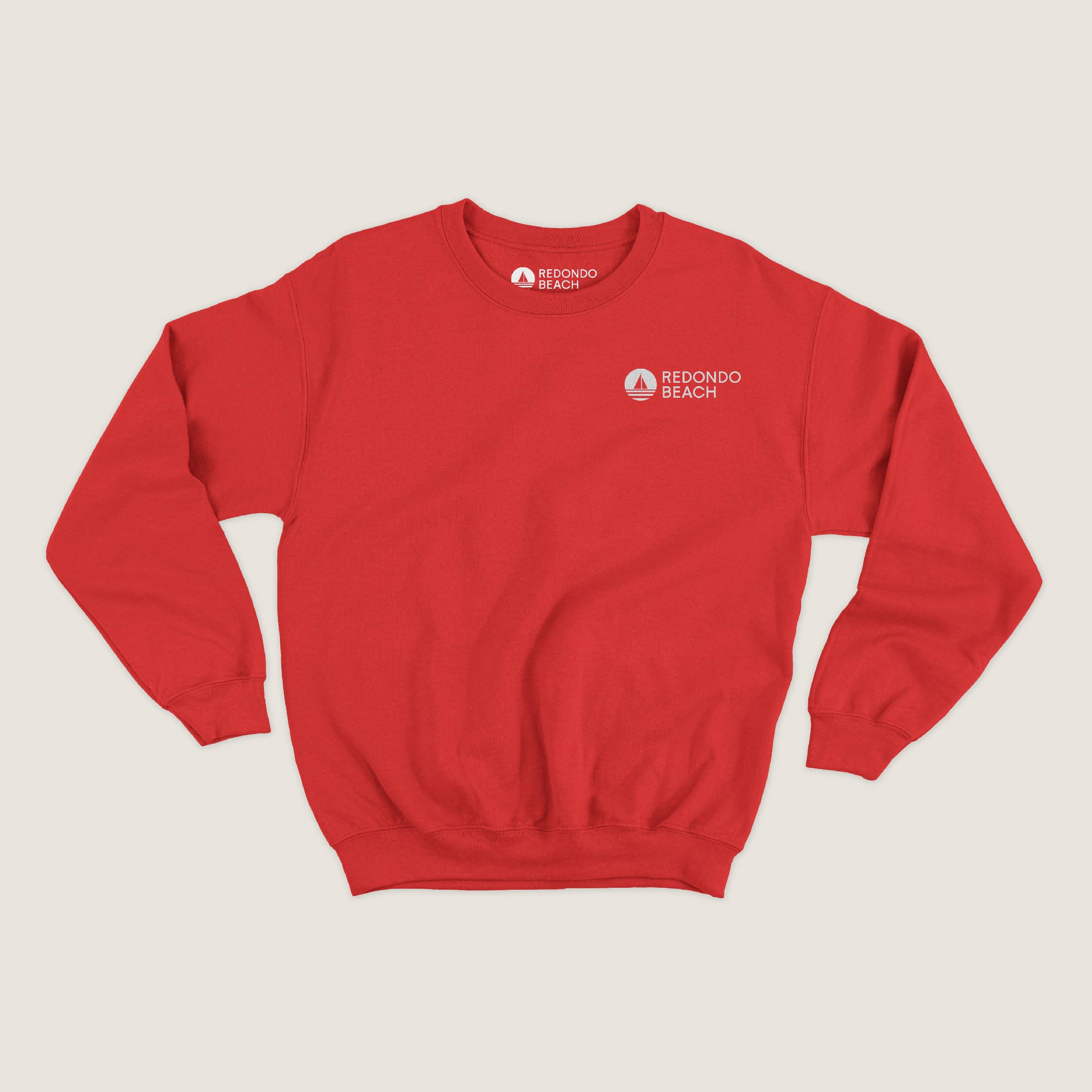 New Redondo Beach logo incorporated as a creative asset on a crew neck sweater, developed by Stellen Design Branding Agency.