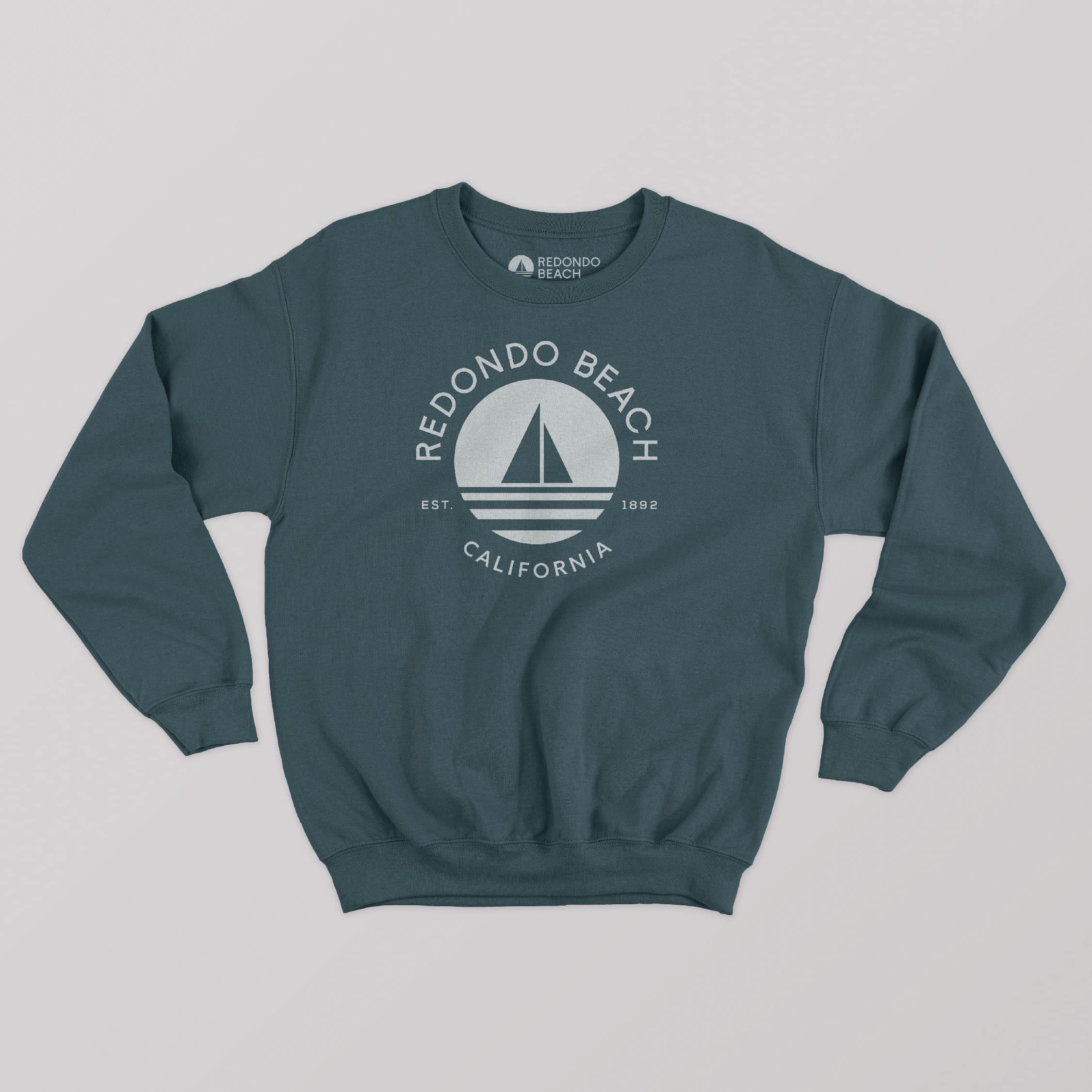 New Redondo Beach logo incorporated as a creative asset on a crew neck sweater, developed by Stellen Design Branding Agency.